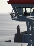 SX03018 Silhouette of captain on bridge of car ferry pulling out Rosslare harbour.jpg